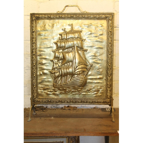 778 - Repousse brass fire screen with galleon decoration, 63cm.