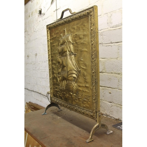 778 - Repousse brass fire screen with galleon decoration, 63cm.