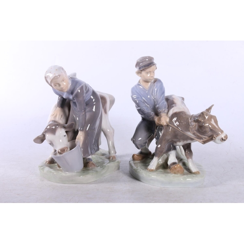 158 - Two Royal Copenhagen figure groups to include Milking Maid #779 and Boy and Calf #772.