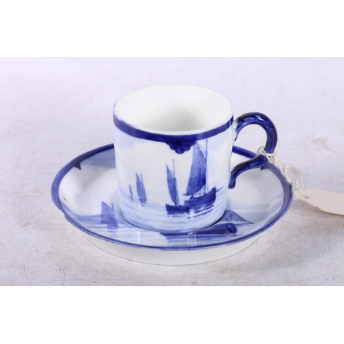 166 - Royal Crown Derby blue and white coffee cup and saucer, depicting sailing ships.