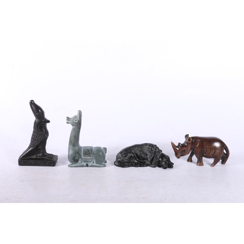 173 - Four models to include Bronzed dog, soapstone Lama, Rhino and another (4).