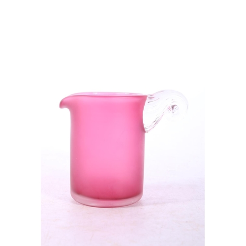 176 - Mid Century pink frosted beaker with scrolling shell handle.