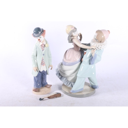 199 - Two Lladro figures to include Masquerade 5452 and Clown with violin 5472 (2).