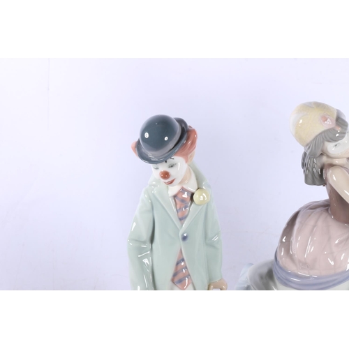 199 - Two Lladro figures to include Masquerade 5452 and Clown with violin 5472 (2).