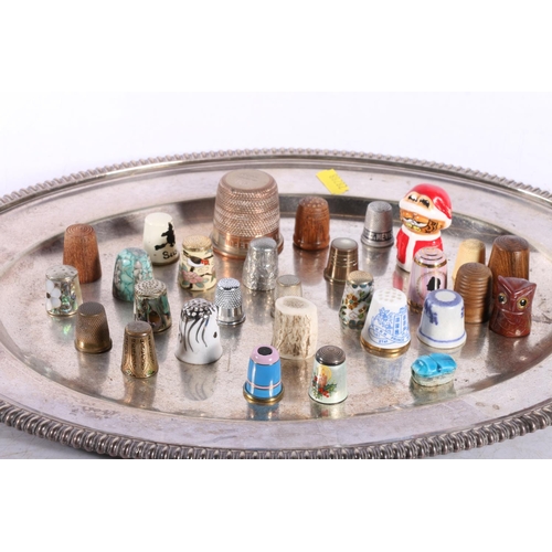 211 - Silver plated tray with a quantity of thimbles to include a enamelled stanhope thimble depicting The... 