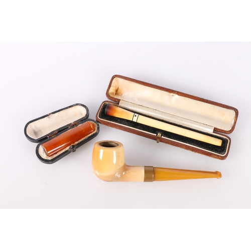 679 - Amber effect cheroot holder, a Dutch pipe and a bone cigarette holder. 