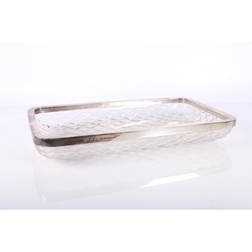 686 - Silver rimmed cut glass dish, the silver mount by Mappin and Webb, Birmingham 1918, 30cm x 17cm./