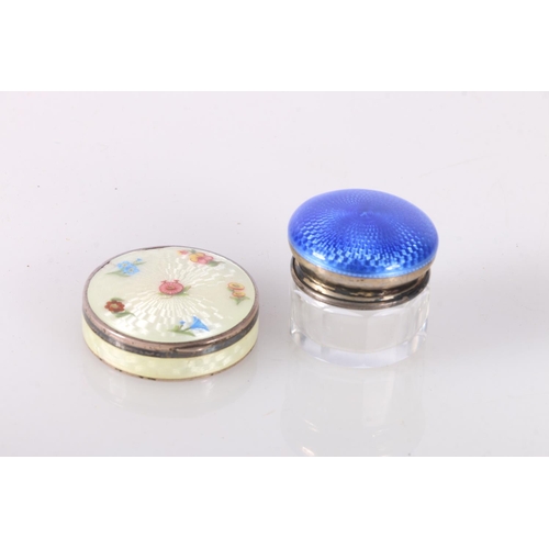 688 - Silver and enamel pill box decorated with flowers, 4cm diameter, and a a silver and enamel lidded bo... 