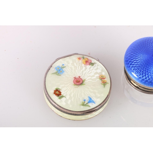 688 - Silver and enamel pill box decorated with flowers, 4cm diameter, and a a silver and enamel lidded bo... 