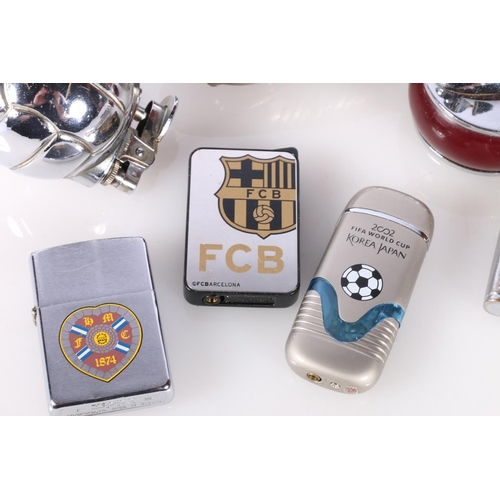 708 - Novelty cigarette lighters to include a football boot, football, Hearts of Midlothian, Barcelona, et... 