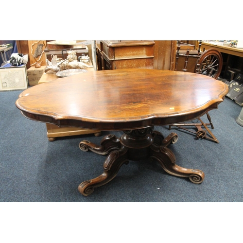 731 - Victorian rosewood tilt top breakfast table, the shaped top above heavy carved, quadruped base, 150c... 