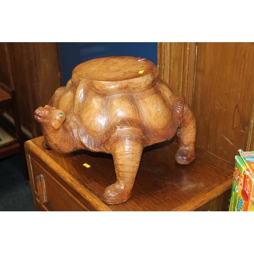 737 - Leather covered plant stand in the form of a tortoise, 26cm high.