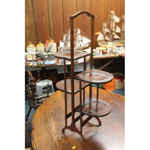 743 - Mahogany folding pot stand, 88cm.