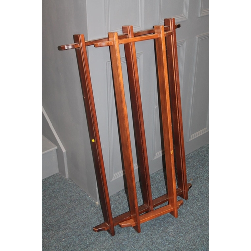 750 - Two mahogany wall mountable plate racks, largest measures, 68cm high.