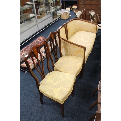 765 - Victorian mahogany and inlaid four piece parlour suits comprising of a sofa and three chairs.