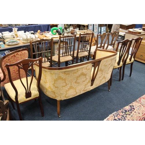 765 - Victorian mahogany and inlaid four piece parlour suits comprising of a sofa and three chairs.