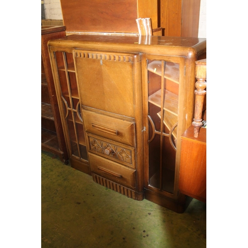 783 - Oak art deco style cabinet with central drawers flanked by twin astragal glazed doors, 121cm wide.