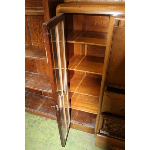 783 - Oak art deco style cabinet with central drawers flanked by twin astragal glazed doors, 121cm wide.