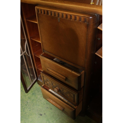 783 - Oak art deco style cabinet with central drawers flanked by twin astragal glazed doors, 121cm wide.