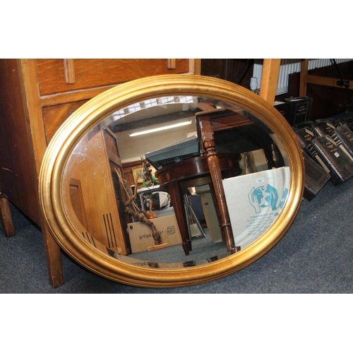 798 - A.W Morris oval gilt framed mirror, 81cm x 63cm.