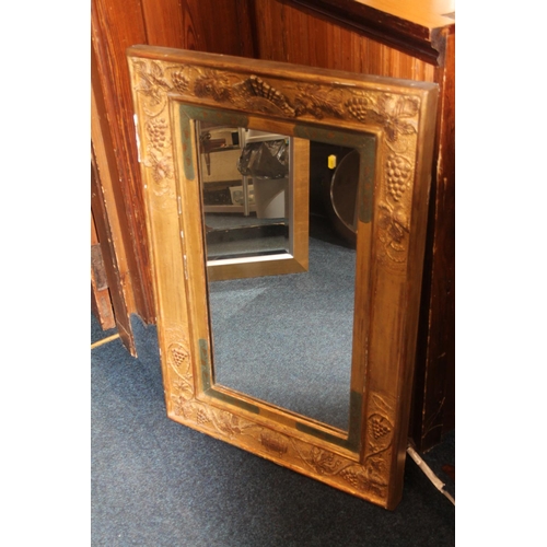 803 - French style gilt framed mirror with grape and vine decoration, 99cm x 67cm