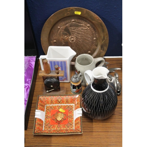 231 - Copper charger decorated with embossed native American indian head, a 1950s style ewer etc,.