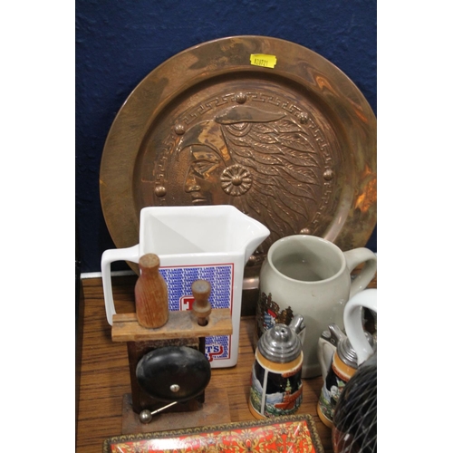 231 - Copper charger decorated with embossed native American indian head, a 1950s style ewer etc,.