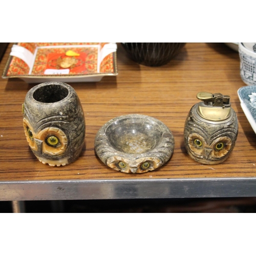 232 - Soapstone smokers items of owl form including a lighter, ashtray etc.