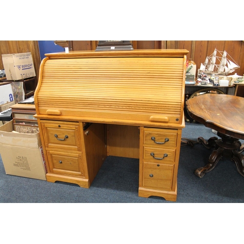 745 - Oak twin pedestal roll top desk with fitted interior, 138cm wide.