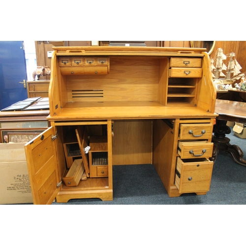 745 - Oak twin pedestal roll top desk with fitted interior, 138cm wide.