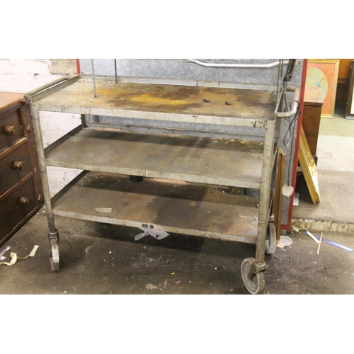 799 - Industrial three tier trolley with working lamp, 128cm wide.