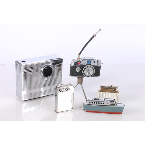 709 - Novelty cigarette lighters to include camera on stand, Rowenta radio, Sarome Crusier etc, 