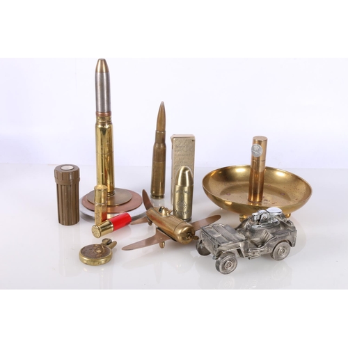 714 - Novelty cigarette lighters to include 'Trench Art' style bullet shell lighter, WWI penny lighter, Je... 