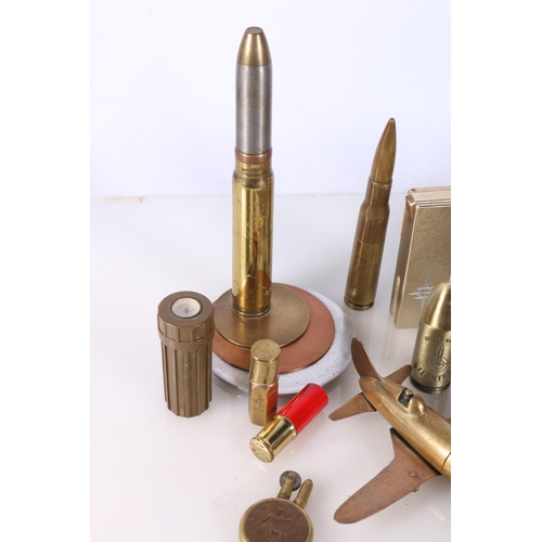 714 - Novelty cigarette lighters to include 'Trench Art' style bullet shell lighter, WWI penny lighter, Je... 