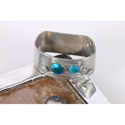 677 - Tudric pewter napkin ring with two Ruskin style roundels, a silver bladed mother-of-pearl handled fr... 