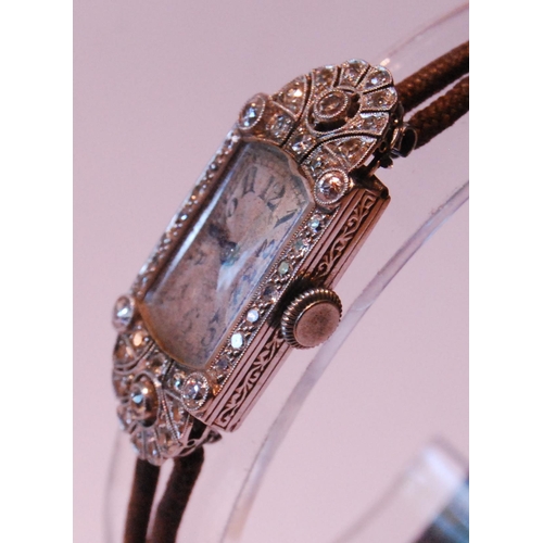 96 - Lady's Art Deco evening watch with sprays and bands of brilliant and eight-cut diamonds, 'Platinum',... 