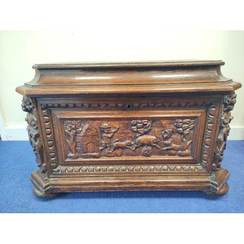 401 - 19th century carved oak cellarette, probably Continental origin, of sarcophagus shape with hinged to... 