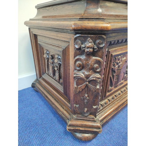 401 - 19th century carved oak cellarette, probably Continental origin, of sarcophagus shape with hinged to... 