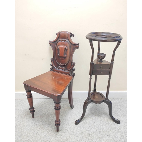 403 - Victorian mahogany hall chair with shaped scroll back bearing scroll cartouche to the centre, on spi... 