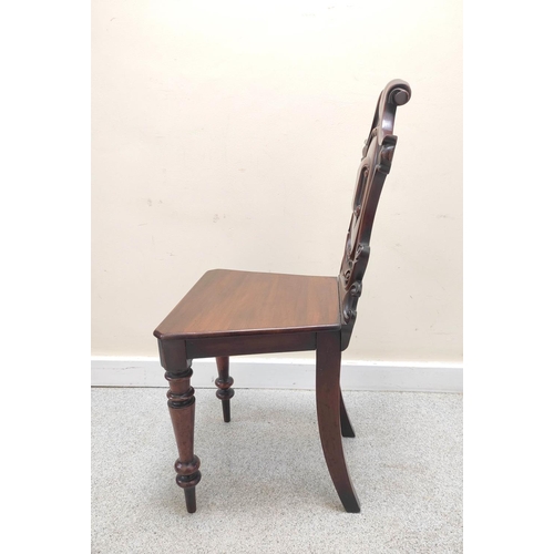 403 - Victorian mahogany hall chair with shaped scroll back bearing scroll cartouche to the centre, on spi... 