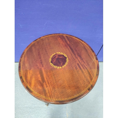 405 - Edwardian inlaid mahogany centre table, The circular top on tapered supports with brass castors with... 