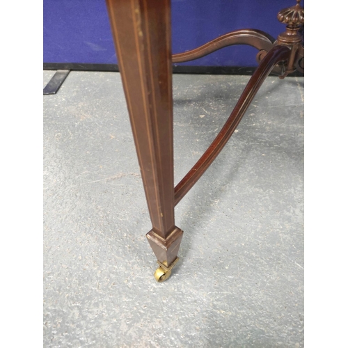 405 - Edwardian inlaid mahogany centre table, The circular top on tapered supports with brass castors with... 