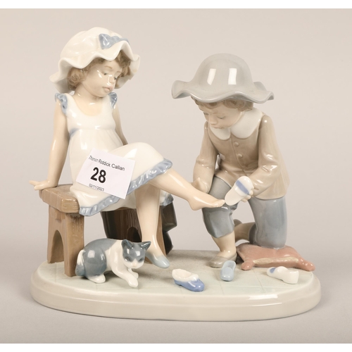 28 - Four Lladro figure of children and animals