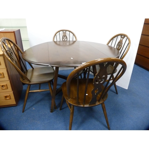 406 - Ercol drop-leaf dining table and a set of four wheel-back spindle chairs.  (5)