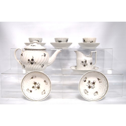 329 - Late 18th century English porcelain part teaset decorated with monochrome flowers and Greek key bord... 