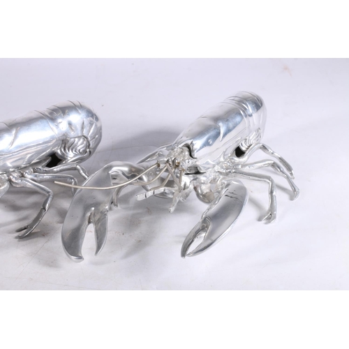 352 - Pair of Louise Bradley white metal lobster models, 30.5cm long.