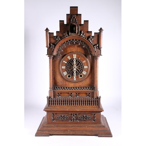 378 - German oak cuckoo clock in architectural castle shaped case, the movement striking on a gong, 67cm t... 