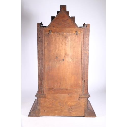 378 - German oak cuckoo clock in architectural castle shaped case, the movement striking on a gong, 67cm t... 