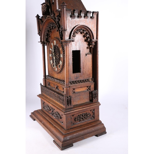 378 - German oak cuckoo clock in architectural castle shaped case, the movement striking on a gong, 67cm t... 