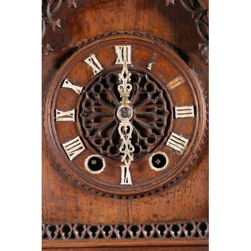 378 - German oak cuckoo clock in architectural castle shaped case, the movement striking on a gong, 67cm t... 